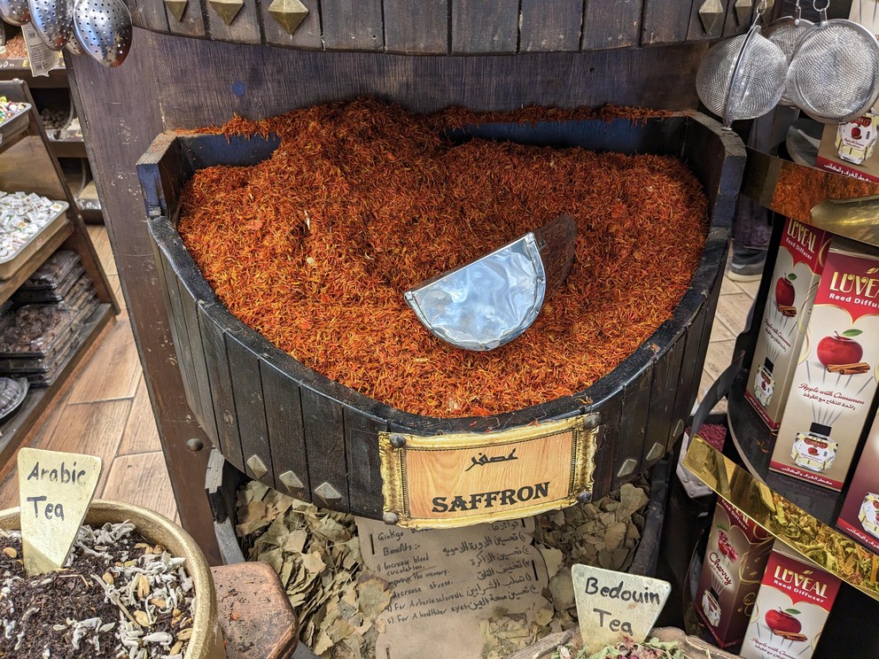 a large round tray filled to the top with red saffron