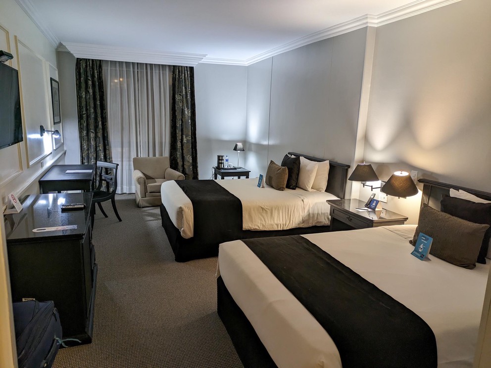 a hotel room with two queen beds
