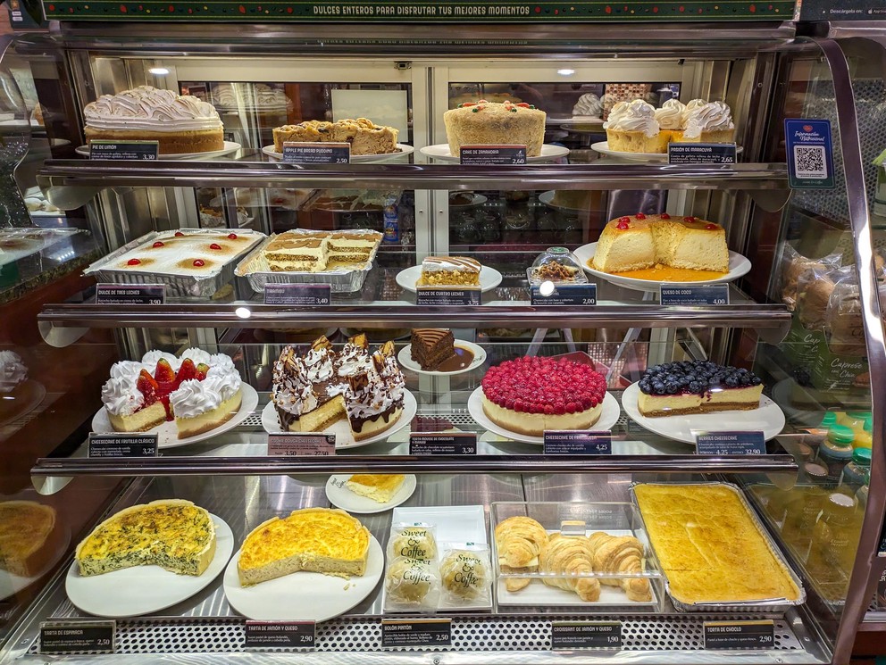 a display case in a coffe shop filled with pastries