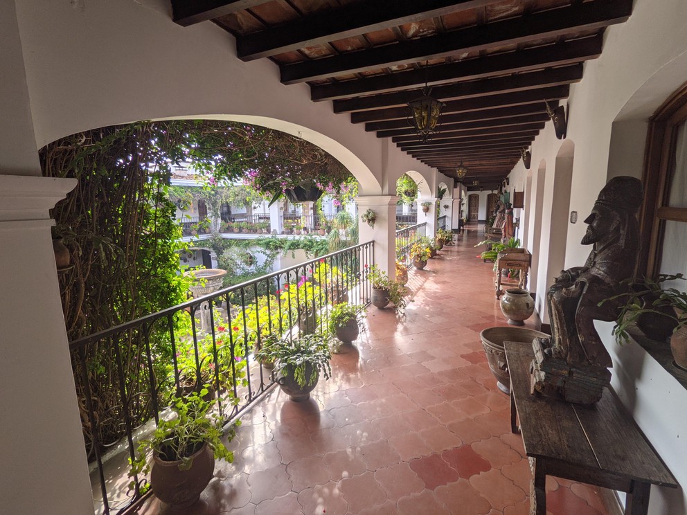 looking down the upper balcony of the Hotel Santo Tomas in Chichicastenango, Guatemala