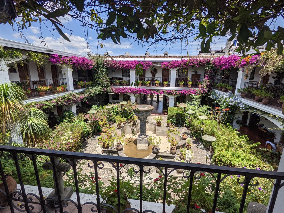 looking down from the balcony into the courtyard garden at Hotel Santo Tomas in Chichicastenango, Guatemala
