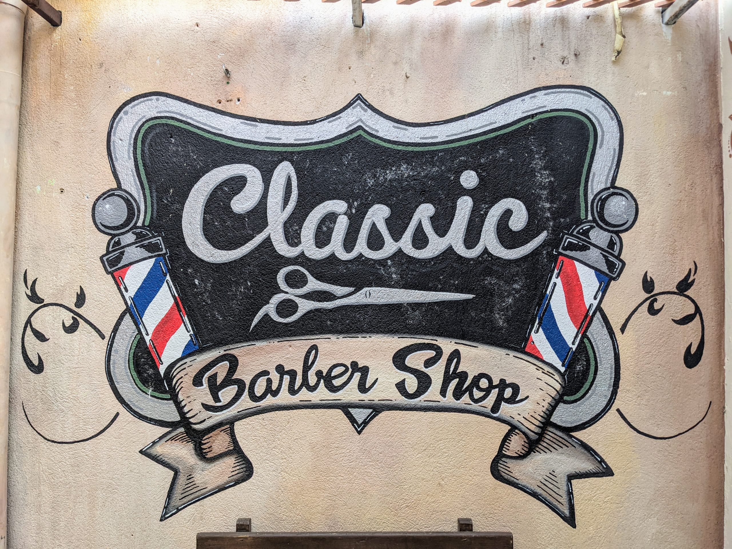 the logo for the Classic Barber Shop in Antigua, Guatemala