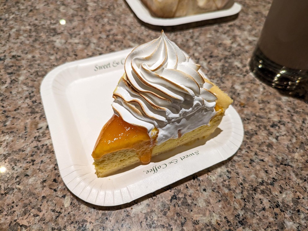 a slice of passion fruit cake with meringue