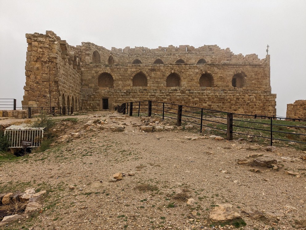 two walls of an ancient castle from the crusades are still standing at the edge of a cliff