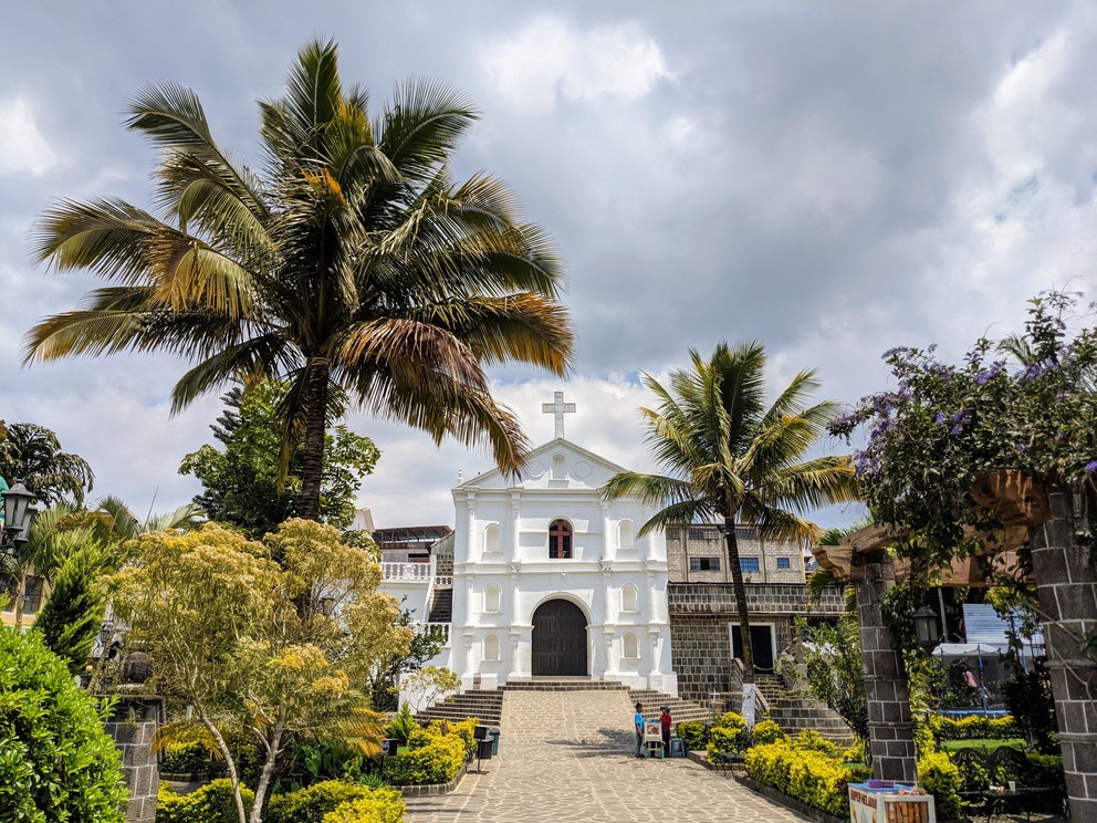 a view of the gardens and steps leading up to the Catholic church in San Pedro La Laguna, Guatemala