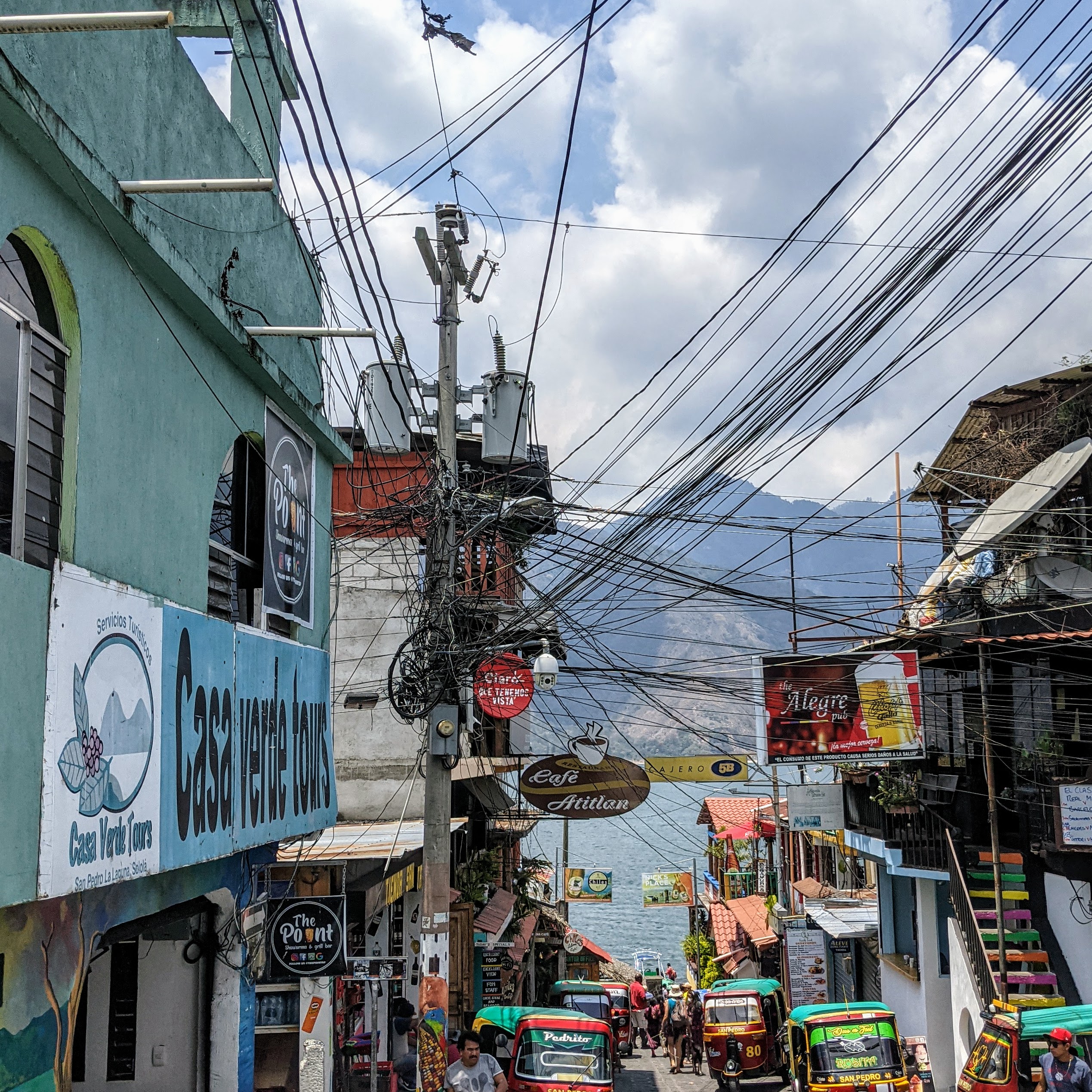 hundreds of electrical wires converge on a single power pole in Guatemala