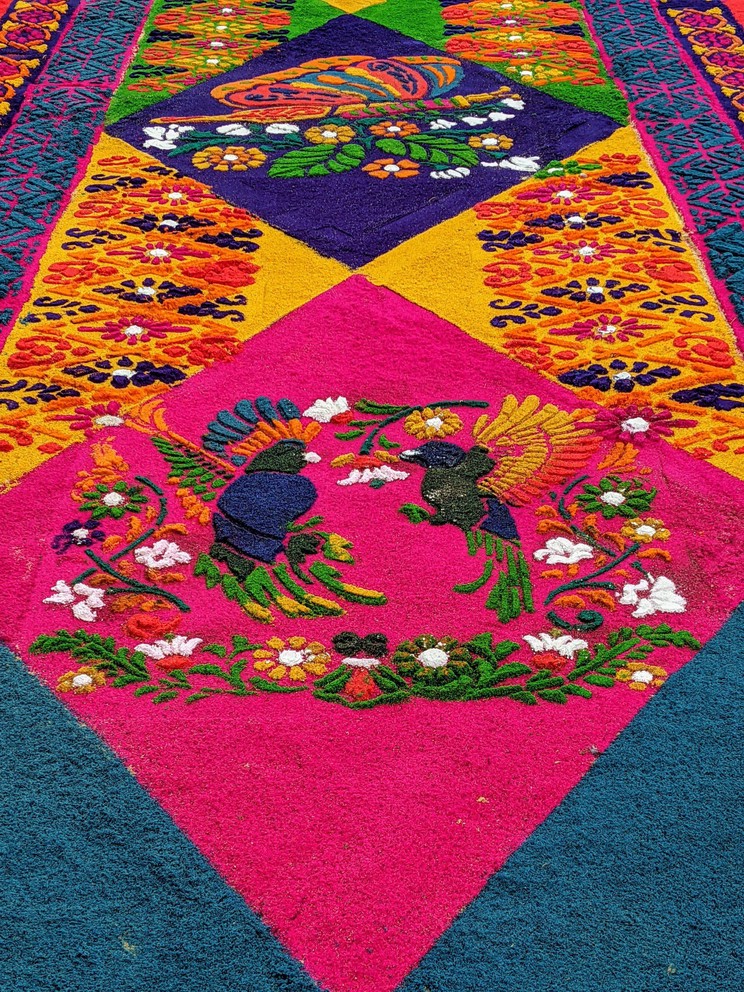 a close-up of an ornate carpet built for holy week in the central plaza of Antigua, Guatemala