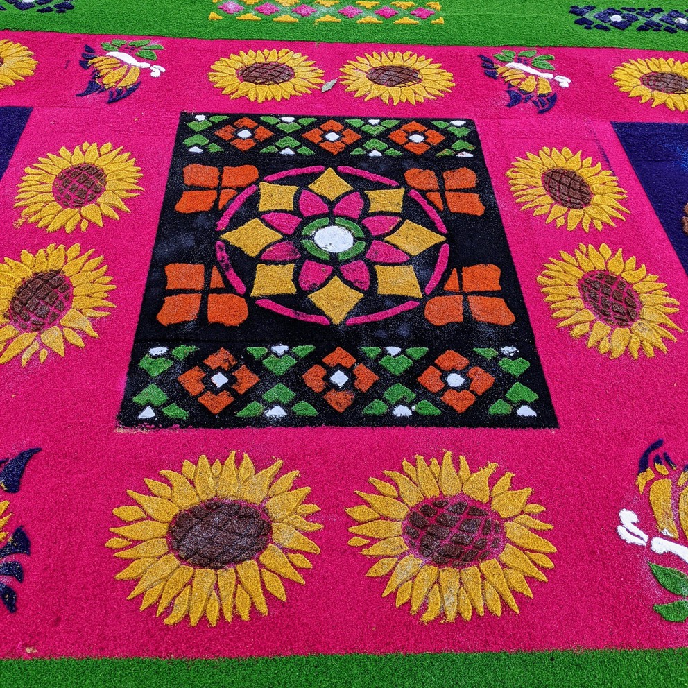 a close-up look at the pattern and design of a sawdust carpet created for semana santa in Antigua, Guatemala
