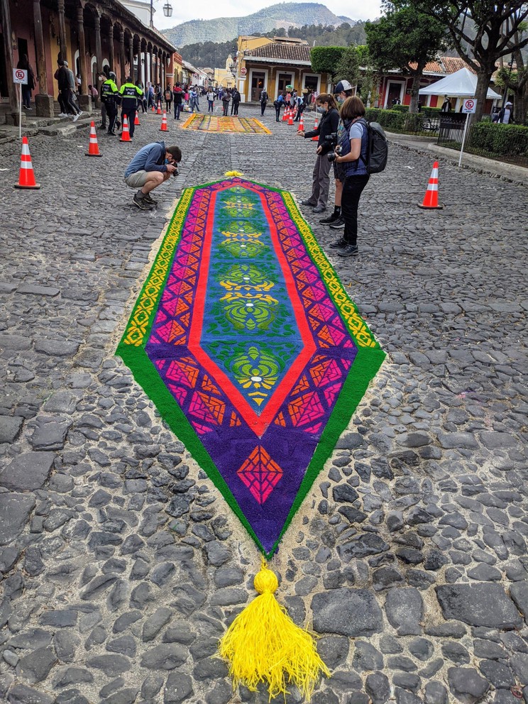 carefully constructed carpets line the streets of the central plaza in Antigua, Guatemala for holy week