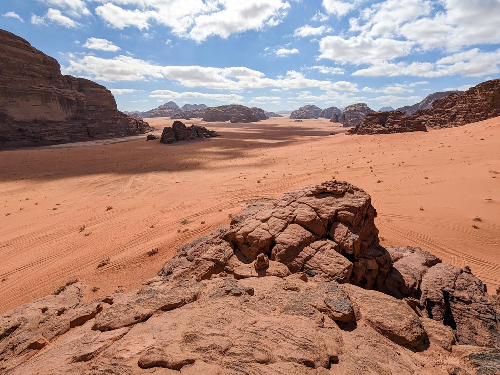 a view into the vast valley of Wadi Rum with its red sands and rock outcroppings
