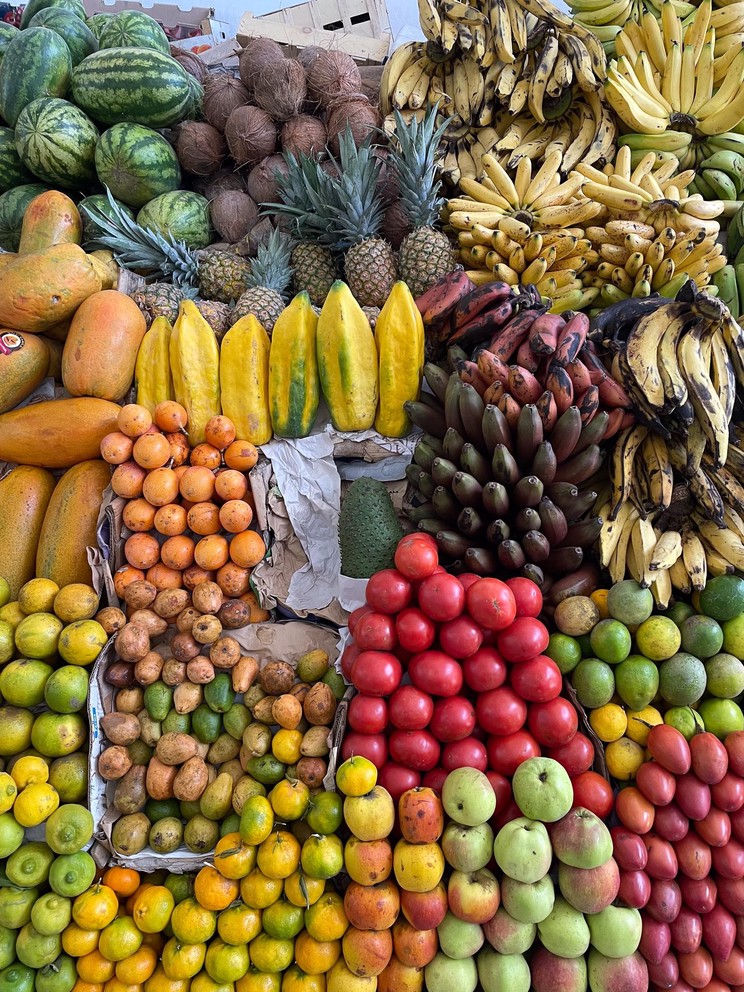 a tropical fruit display inside a tienda