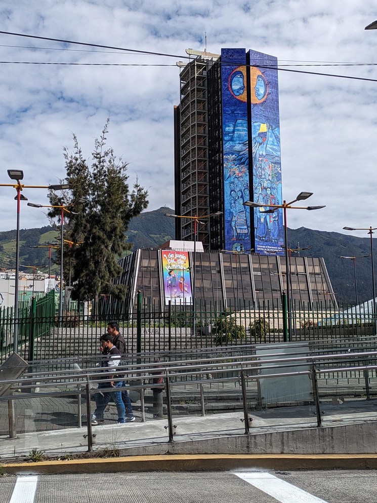 a tall building painted top to bottom with a large blue mural