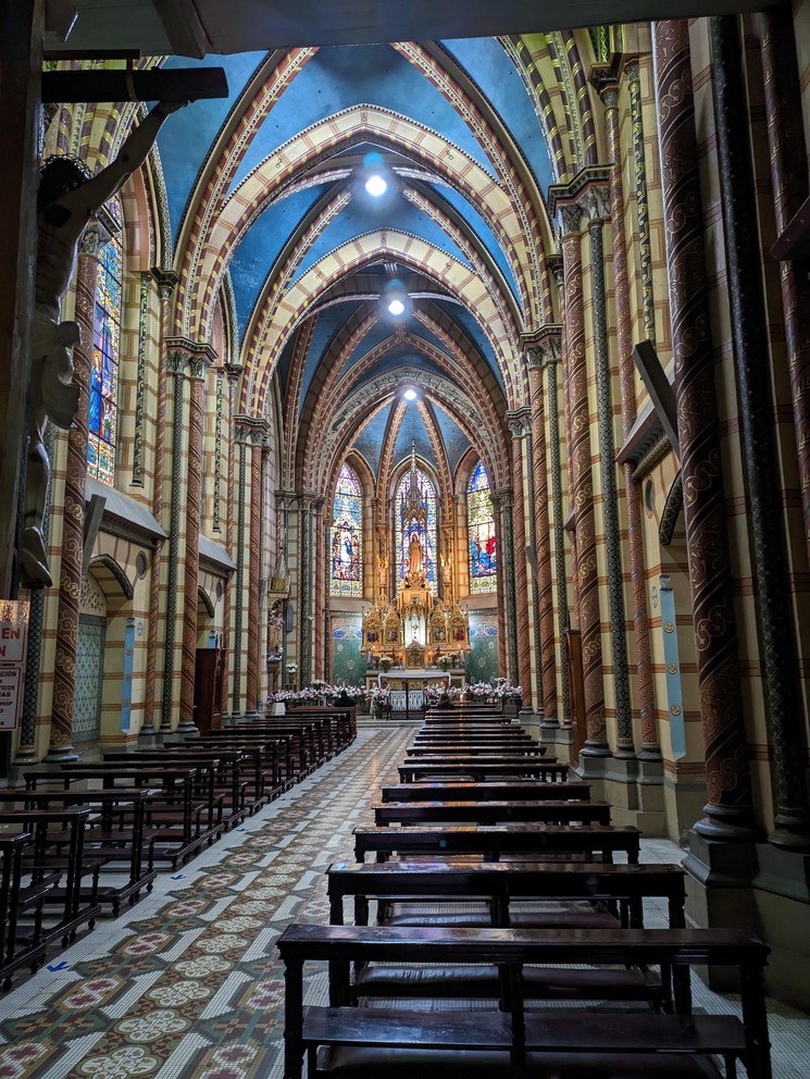 empty rows of pews in the Chapel of the Immaculate Heart of Mary