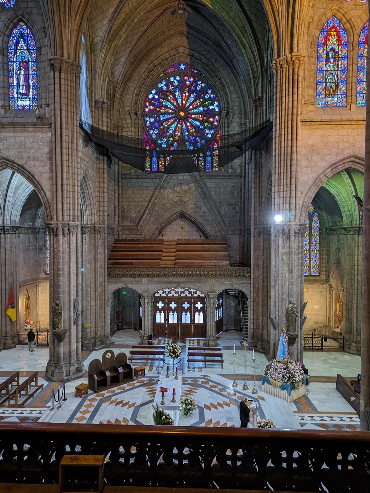 a view of the Nave and stained glass windows in the Basilica del Voto Nacional